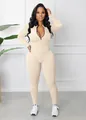 Front view of beige ribbed long sleeve sports jumpsuit with front zipper detail - Apricot