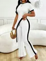 Chic white ribbed two-piece set featuring asymmetrical crop top and black striped wide-leg pants - S / Top And Bottom / White