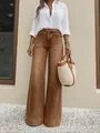 Full shot of a model wearing vintage brown washed wide-leg jeans with a white shirt - S / Dark Brown