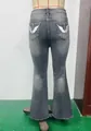 Rear view of washed grey flared jeans with silver wing embroidery on back pockets - S / Bottoms / Black