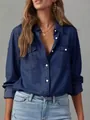 Detailed view of a stylish dark blue long-sleeved denim shirt featuring lapel and pockets. - S / Tops / Dark Blue