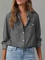 Detailed macro view of a charcoal gray long-sleeve button-down denim shirt for women - S / Tops / Gray