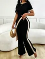 Detailed side view of black ribbed knit outfit showing the waist cut-out and texture. - S / Top And Bottom / Black