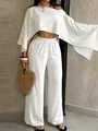 Conjunto de playa blanco con top corto sin hombros y pantalones de pierna ancha. - Blanco