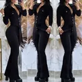 Full length view of elegant black long-sleeved jumpsuit with shirt collar and flared trousers - S / Set / Black