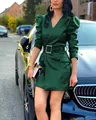 Detail of a dark green faux leather mini dress with puff sleeves and deep V-neck - S / Dresses / Green