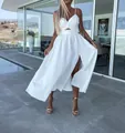 Elegante vestido midi blanco de tirantes finos con abertura en la cintura y abertura - S / Vestidos / Blanco