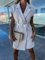 Close-up of elegant cream sleeveless blazer dress showing belt and button details - S / Dresses / Gray