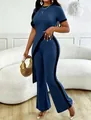 Full view of a blue ribbed two-piece set with cutout top and side-stripe flared pants. - Blue