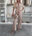 Elegant beige short sleeve wide-leg jumpsuit featuring a shirt collar and tie-waist - S / Jumpsuits / Khaki
