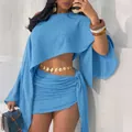 Completo due pezzi blu con top monospalla e minigonna a portafoglio per vacanze al mare - Azzurro