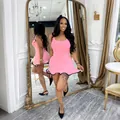 Elegant pink sleeveless summer mini tank dress featuring a black wavy ruffled hem - S / Dresses / Pink