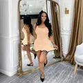 Chic sleeveless bodycon tank mini dress in peach featuring a wavy black-edged ruffled hem - Apricot