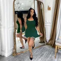 Sleeveless dark green ribbed bodycon mini dress with white wavy lettuce hem detail - Dark Green