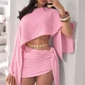 Elegant pink two-piece vacation outfit featuring an off-shoulder top and ruched wrap mini skirt - S / Top And Bottom / Pink