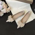 Elegante champagnerfarbene Glitzer-Ballerinas mit einer wunderschönen Strass-Schleife - 34 / Gold