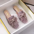 Sparkling glitter flat mules featuring a decorative pearl bow inside a white shoe box. - 34 / Pink