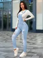 Full body detail view of women's slim fit distressed light blue denim overalls set - XS / Bottoms / Light Blue