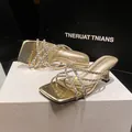 Elegant gold high-heel sandals with sparkling rhinestone straps and a trendy square toe - 34 / Gold