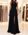 Detailed view of elegant black halter lace and chiffon evening gown with high leg slit - S / Dresses / Black