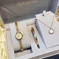 Macro view of a luxury jewelry gift set including a gold watch, necklace, and bangle in a box - Rhinestone Round Dial (2610) / 3-Piece Set Gift Box / Gold (2610)