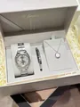Elegant silver watch gift set featuring a ladies watch, bangle, and necklace in a pink box. - Watch Only / Silver Gray