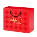 Elegant red diamond pattern jewelry gift packaging bag with sturdy black rope handles - Qingyu Gift Bag