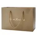 Elegant champagne gold gift shopping bag with rope handles and gold text engraving - LR Champagne Gold Bag