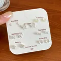 Set of seven pairs of silver minimalist stud earrings featuring stars and butterflies - Minimalist Butterfly Style (BMW13)