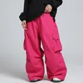 High-performance professional waterproof loose-fit snow pants in vibrant hot pink color - Rose Red