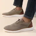 Close-up of men's breathable knit walking shoes with thick white soles on model - 40 / Khaki