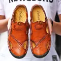 Close-up of premium brown leather and handmade stitching on men's breathable summer sandals - 38 / 898 Red Brown