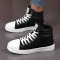 Side view of stylish black and white high-top leather boots for casual wear - 35 / Black