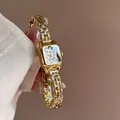 Primo piano dell'orologio bracciale oro GUOU con quadrante leopardato e numeri romani - Quadrante Stampa Leopardata / Oro
