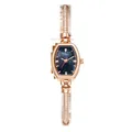 Elegant rose gold women's watch with crystal-encrusted band and dark navy dial - Hexagonal Dial / Rose Gold Blue