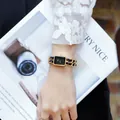 Elegant women's gold chain watch with black octagonal dial and woven bracelet strap - Gold & Black