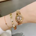 Elegant DINIMI gold women's quartz watch with a round face and Roman numeral dial - Rose Gold Metal Strap Full Rose Gold
