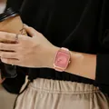 GUOU women's square minimalist watch with pink silicone strap in lifestyle setting. - Pink Gold Frame (8162 Silicone Strap) / Pink