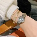 DINIMI elegant ladies quartz watch featuring a silver round case and tan leather strap - Grey Leather Silver Case