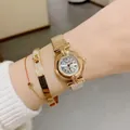 Elegant DINIMI women's quartz watch with retro Roman numerals and golden finish. - Rose Gold Stretch Band White Dial