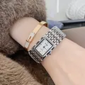 Elegant silver-tone square quartz watch paired with a sparkling gold crystal bracelet. - Silver White