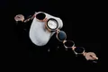 Elegante orologio da polso da donna in oro rosa con maglie circolari in pietra nera - Nero