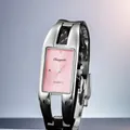 Close-up of a vintage pink dial watch with silver bangle bracelet design - Pink