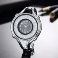 Close-up of elegant silver bracelet watch for women with floating diamonds and black dial - Silver Black