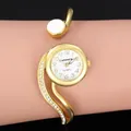 Vista dettagliata dell'orologio da donna CANSNOW in oro con cinturino di cristalli - Oro Bianco