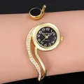 Vista dettagliata dell'elegante orologio a bracciale CANSNOW oro da donna con quadrante nero - Oro Nero