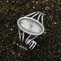 Elegant silver oval face quartz bangle watch with a minimalist metallic strap design - Silver White Face