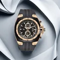 Close-up of luxury men's quartz watch with black silicone strap and rose gold detailing - Gold