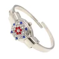 Close-up of elegant rhinestone-encrusted flip cover on ladies' silver bangle watch - Random Pattern / Silver