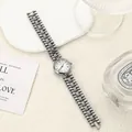 Vintage silver-tone women's quartz watch with a sophisticated metal link bracelet strap. - White Silver